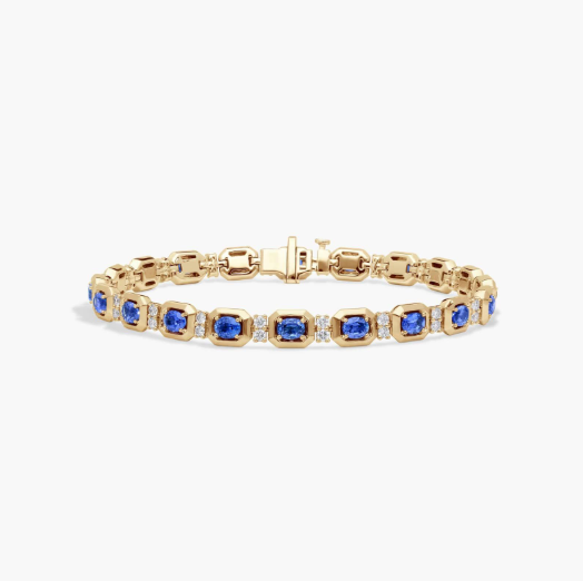 Oval Cut Blue Sapphire and Diamond Alternating Tennis Bracelet In 14K Yellow Gold