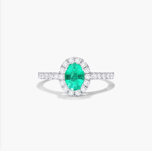 Oval Halo Emerald And Diamond Ring In 18K White Gold