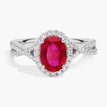 Oval Ruby and Diamond Halo Twist Ring (8x6mm)