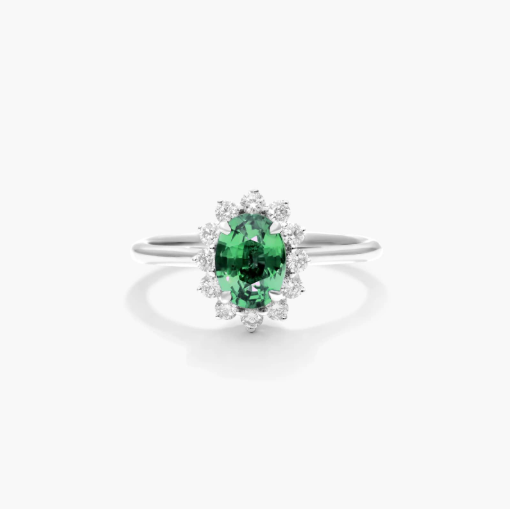 Oval Halo Emerald And Diamond Ring In 18K White Gold