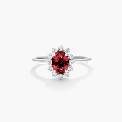 Oval Halo Ruby And Diamond Ring In 18K White Gold